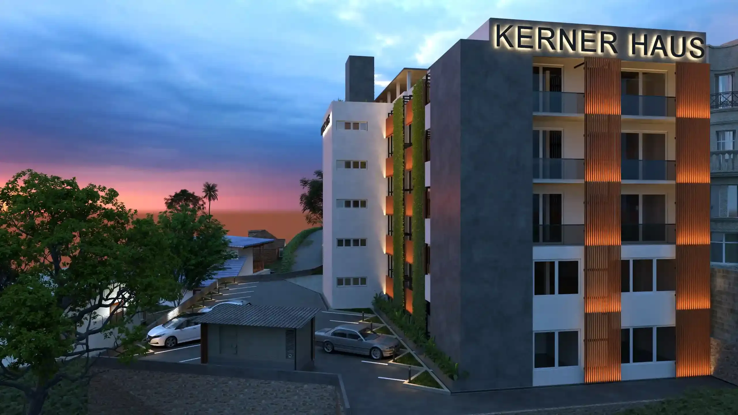 The Kerner Haus headquarters at golden hour, its lit rooftop signage glowing above Colombo